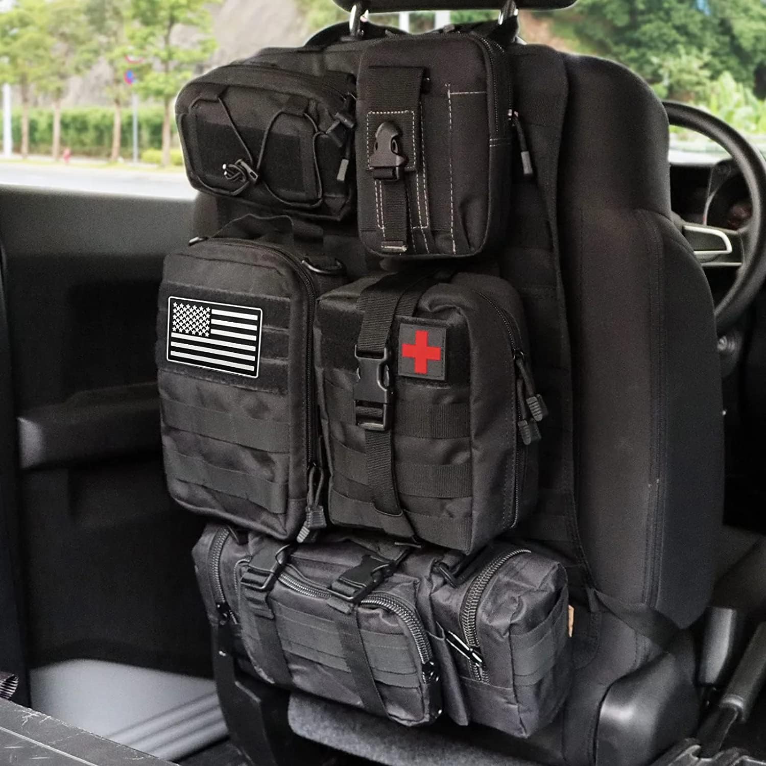 Tactical car seat back organizer with 5 detachable MOLLE pouches installed in SUV